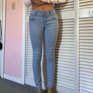 Mid-rise light blue jeans.